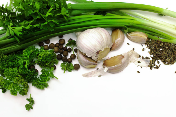 Green onions, parsley, garlic and spices isolated on white.  - Foto, imagen