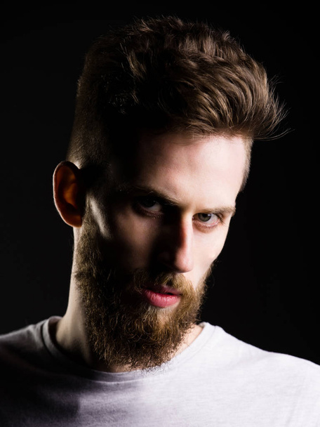 serious bearded guy with stylish brunette hair in shirt - Foto, immagini