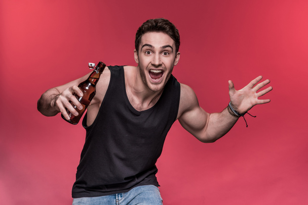 Young man with beer  - Foto, immagini