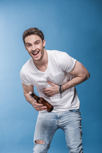 Young man with beer  - Fotoğraf, Görsel