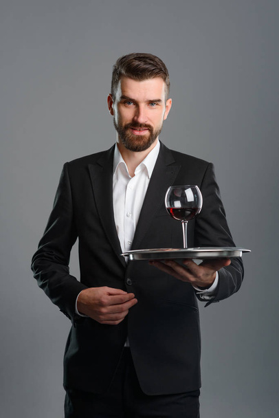 Sommelier holding tray with wineglass - Zdjęcie, obraz