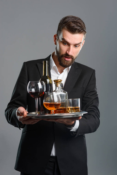 Man holding tray with beverages - Foto, imagen