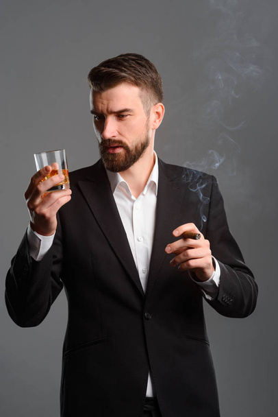Rich man with drink and tobacco - Фото, зображення
