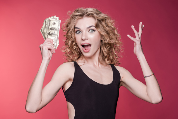 woman holding dollars - Zdjęcie, obraz