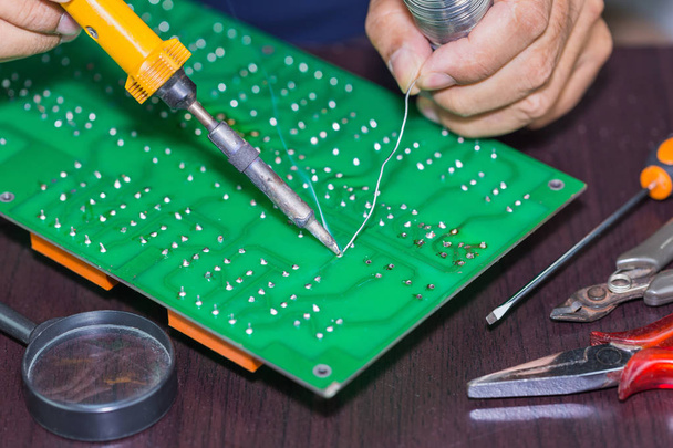 Soldering on circuit board - Photo, image