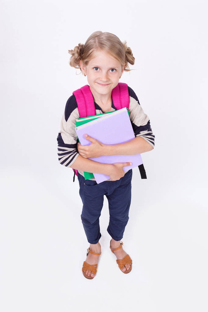 schoolgirl with books hands  - Φωτογραφία, εικόνα