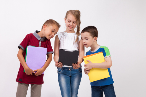 schoolchildren with tablet and phone - Φωτογραφία, εικόνα
