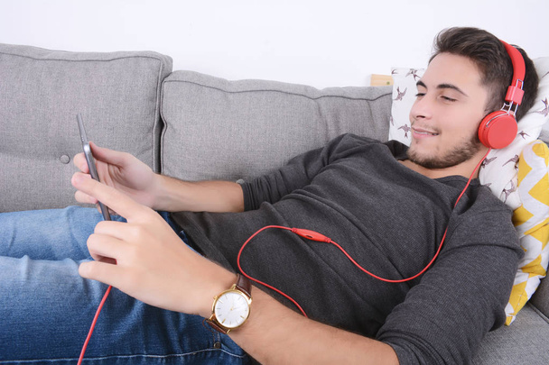 Man listening music with tablet. - Foto, imagen