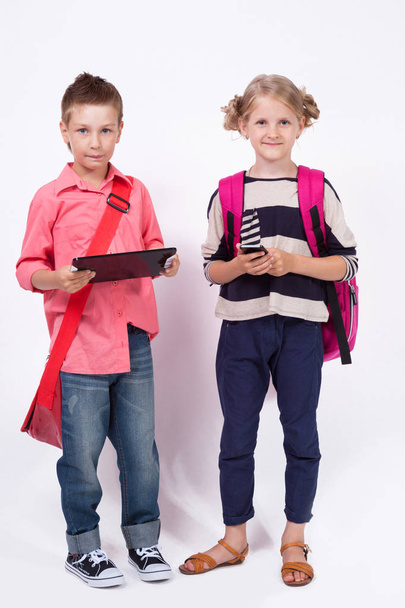 schoolchildren with tablet and phone - Foto, Imagem