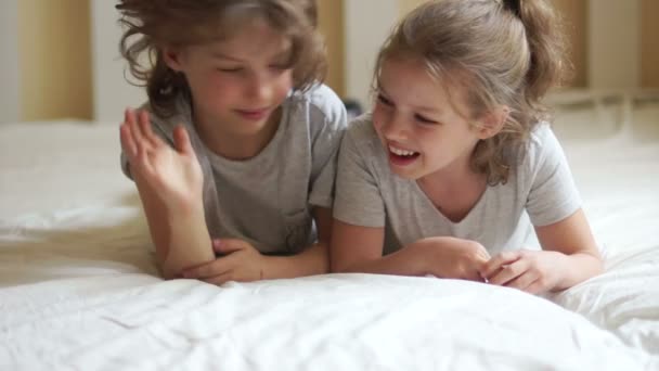 Brother And Sister Relaxing Together in the Bed. - Video
