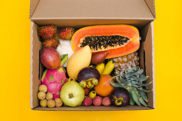 Fresh fruit in a cardboard box - Photo, Image