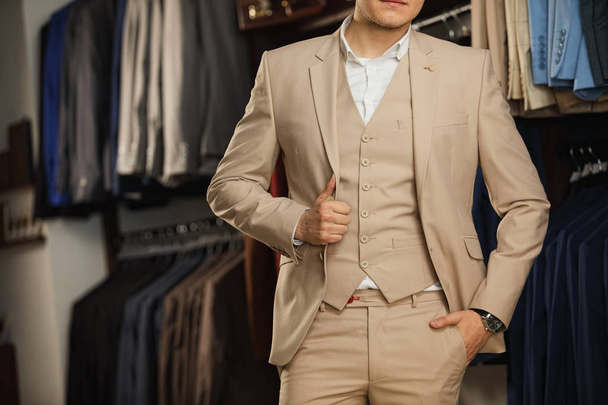 Cropped image of young man buttoning his jacket. successful businessman - Фото, зображення