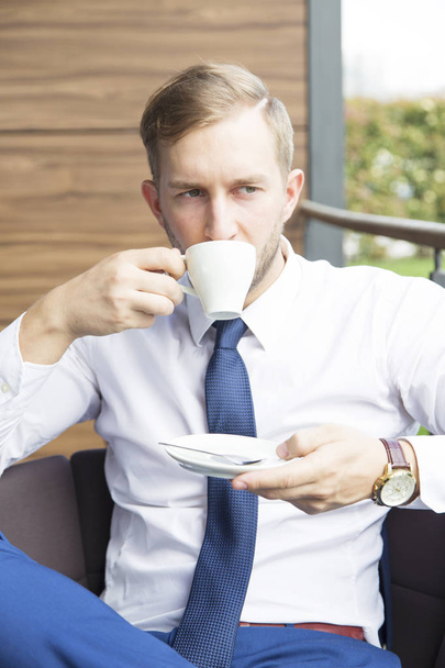 Modern businessman sitting at coffee shop  - Foto, imagen