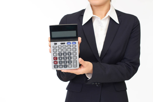 Woman holding a calculator - Фото, зображення