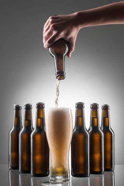Pouring beer into a glass - Zdjęcie, obraz