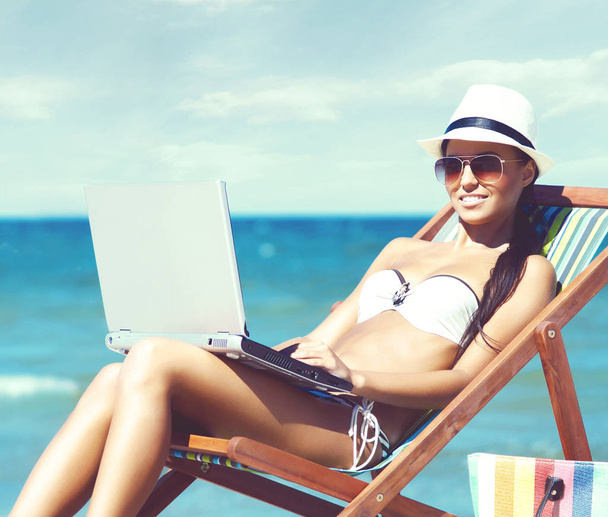 beautiful woman relaxing on summer beach - Fotó, kép