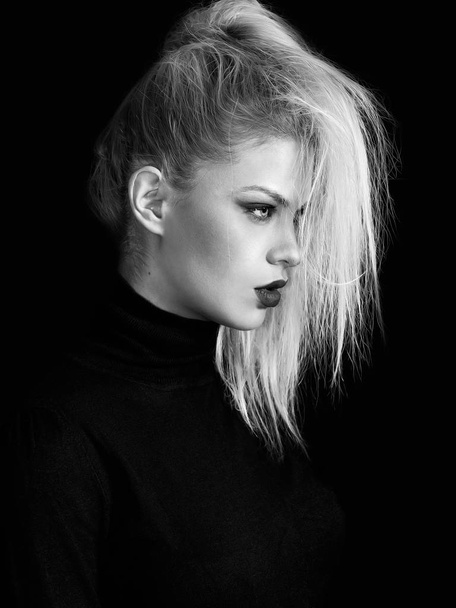 Blonde pretty girl profile portrait on black background, monochrome - Foto, Imagem