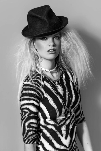 Boho beautiful girl monochrome portrait wearing hat and zebra-striped dress - Foto, Imagem
