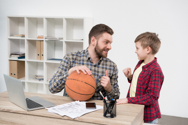 Businessman with son at home office - Photo, Image
