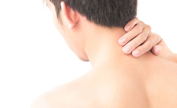 Closeup man hand holding neck or shoulder with pain on white background - 写真・画像