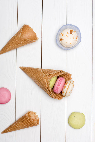 waffle cones with colorful macarons  - Photo, Image