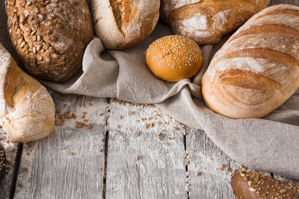 Bread background on rustic wood - Foto, imagen