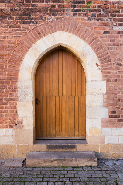 Old wooden door of the Catholic church in Bohemia - 写真・画像