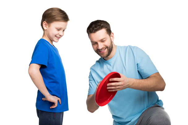 Ojciec i syn, grając z frisbee - Zdjęcie, obraz
