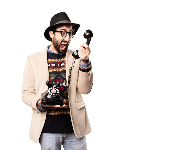 young cool hipster with a vintage phone - Foto, Imagem