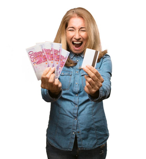 woman with credit card and banknotes  - Foto, afbeelding