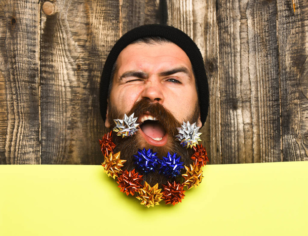 Bearded man, brutal caucasian satisfied hipster with gift decoration stars - Zdjęcie, obraz