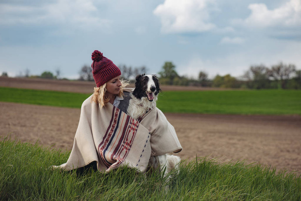 Woman and dog outdoors, lifestyle concept - Photo, Image