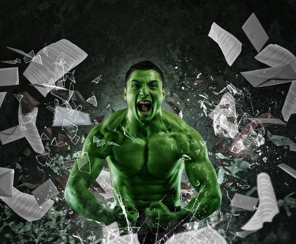 muscular man screaming breaks a glass  - Photo, Image