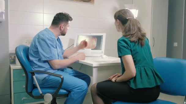 A young woman consults a doctor about gastroscopy 4k - Felvétel, videó