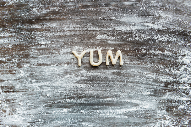 word yum made from dough - Valokuva, kuva