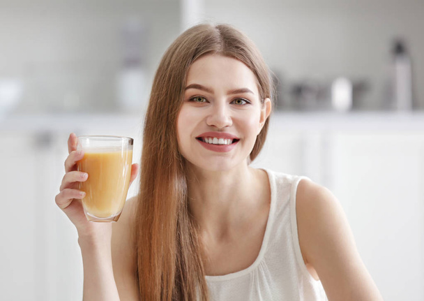 Young woman tasting juice - Foto, immagini
