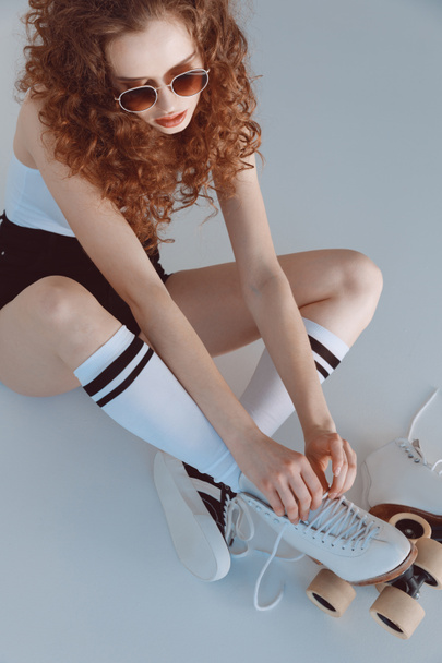 Hipster girl with roller skates  - Foto, afbeelding