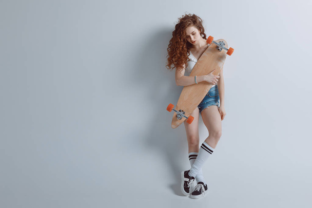 hipster girl with skateboard  - Foto, Bild