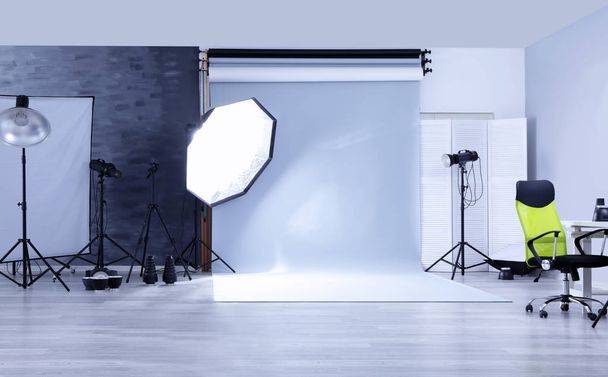 studio with professional lighting equipment - Fotó, kép