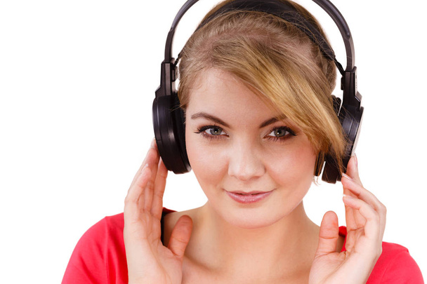 Woman in big headphones listening music isolated - Foto, afbeelding