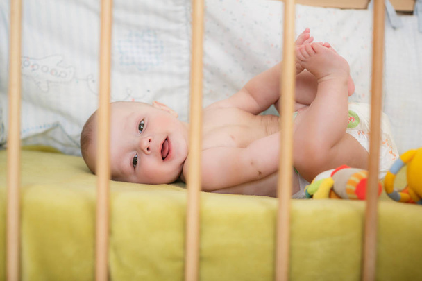 Portrait of  newborn boy is lying in the bed - Fotografie, Obrázek