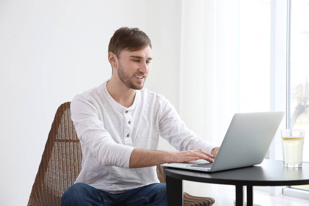 young man working with laptop  - Φωτογραφία, εικόνα
