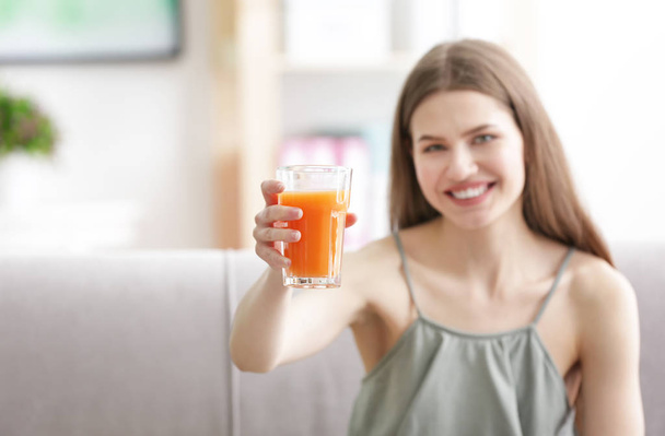 Young woman tasting juice - Fotó, kép