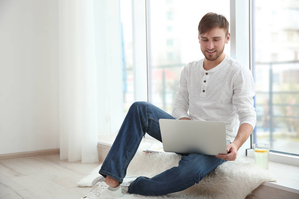 Handsome man with laptop  - Foto, immagini