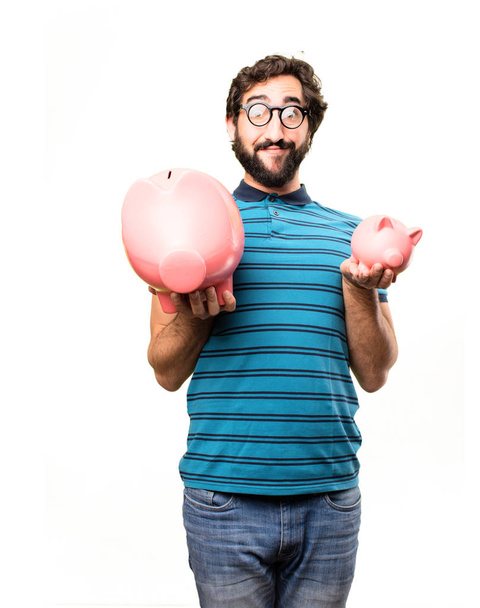 young cool man with a piggy banks - Foto, afbeelding