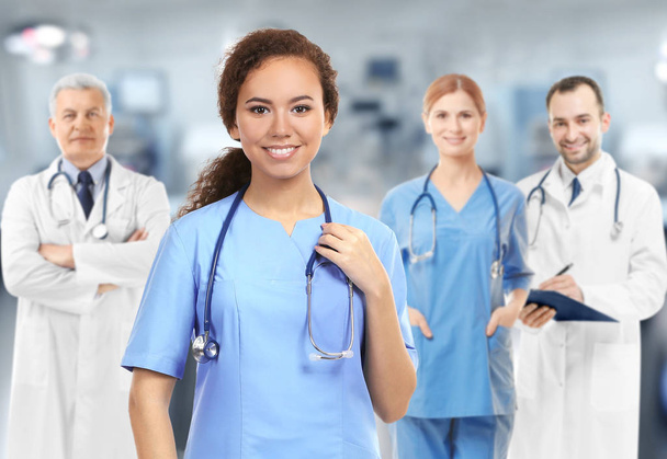 Medical staff on blurred hospital background - Foto, imagen