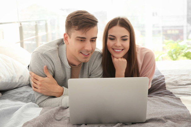 young couple with laptop   - Φωτογραφία, εικόνα