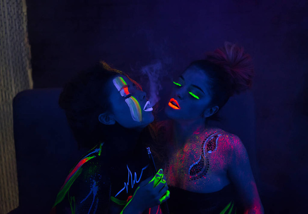 Sexy lesbian fashion models in uv neon light - Photo, Image