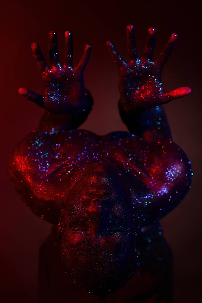 Man in glitters body art in studio - Photo, image
