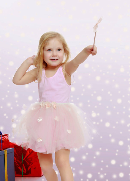 Little girl with a magic wand. - Valokuva, kuva
